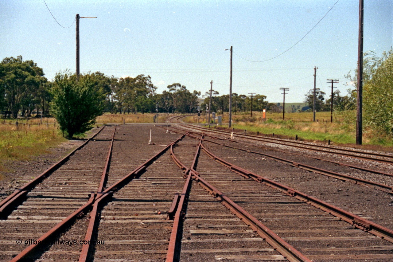 129-2-15
Nyora yard view, old stock yard on left, looking down direction east across Poowong Road towards Korumburra.
