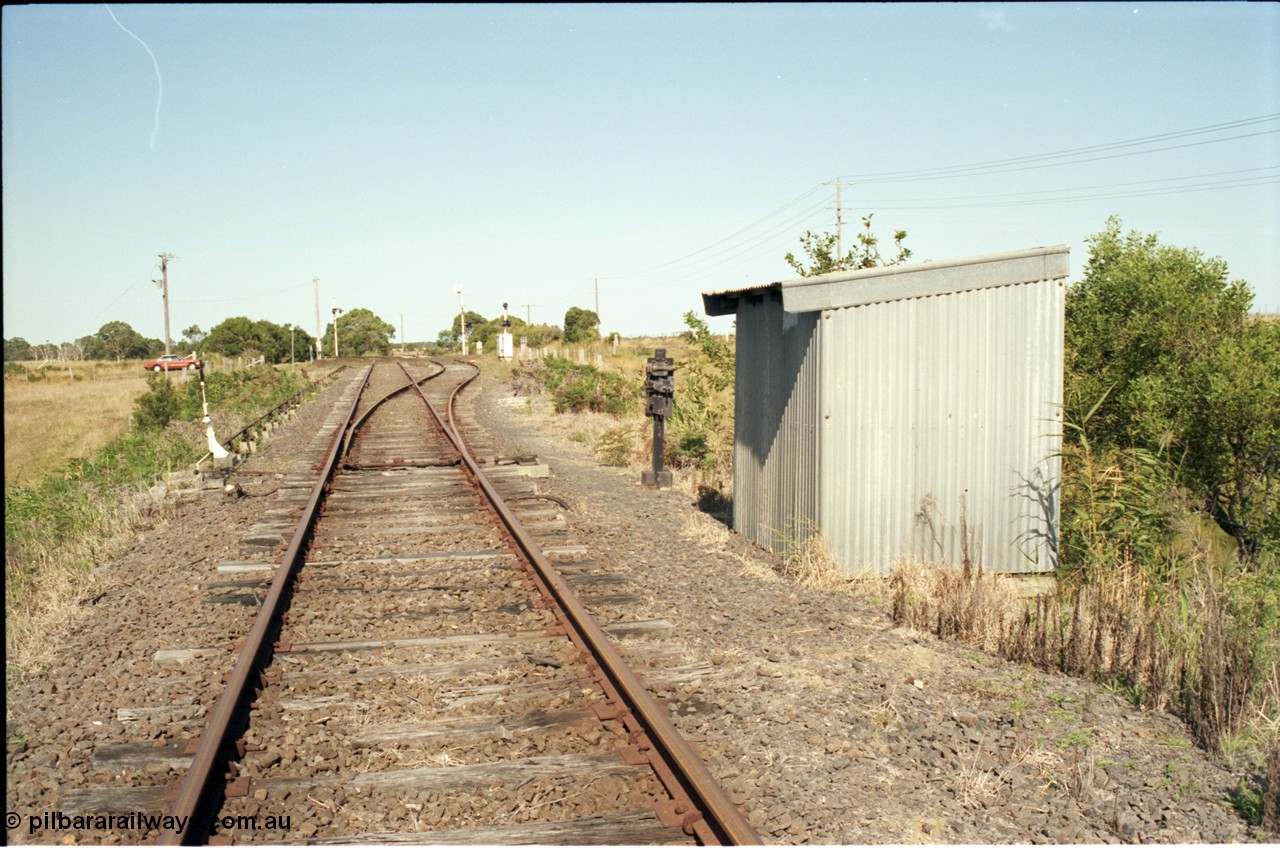 129-3-12
Barry Beach Junction track overview, junction points, Welshpool - Yarram line is main, line to Barry Beach and ESSO complex on the right, redundant staff lock opposite points and lever.
