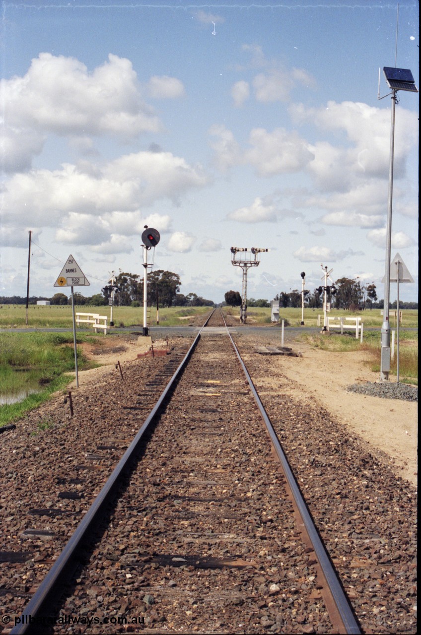 131-1-11
Barnes, track view, looking south, searchlight and semaphore signals, location sign.
