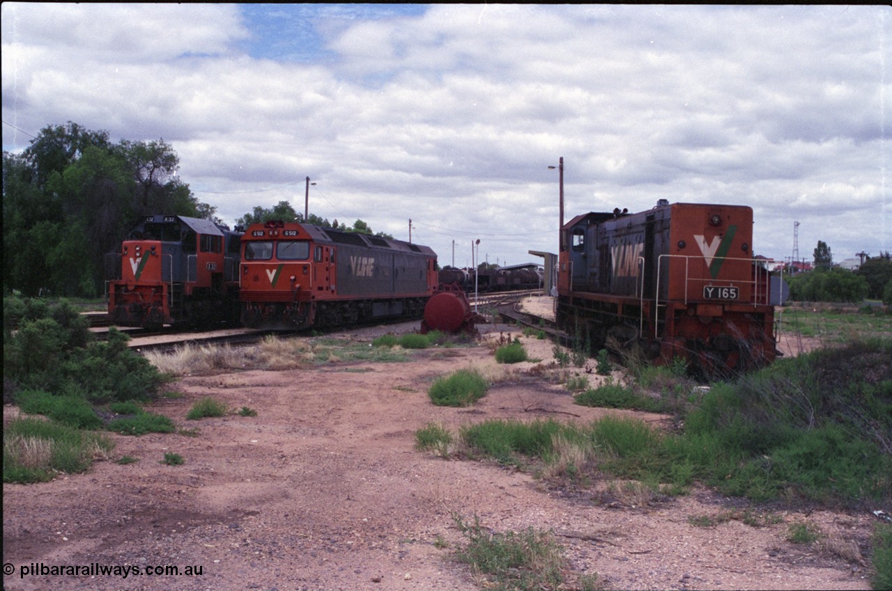 132-18
Mildura loco depot overview looking south, V/Line broad gauge locos X class X 32 Clyde Engineering EMD model G16C serial 66-485, G class G 512 Clyde Engineering EMD model JT26C-2SS serial 84-1240 and Y class Y 165 Clyde Engineering EMD model G6B serial 68-585 on the pit road.
Keywords: Y-class;Y165;Clyde-Engineering-Granville-NSW;EMD;G6B;68-585