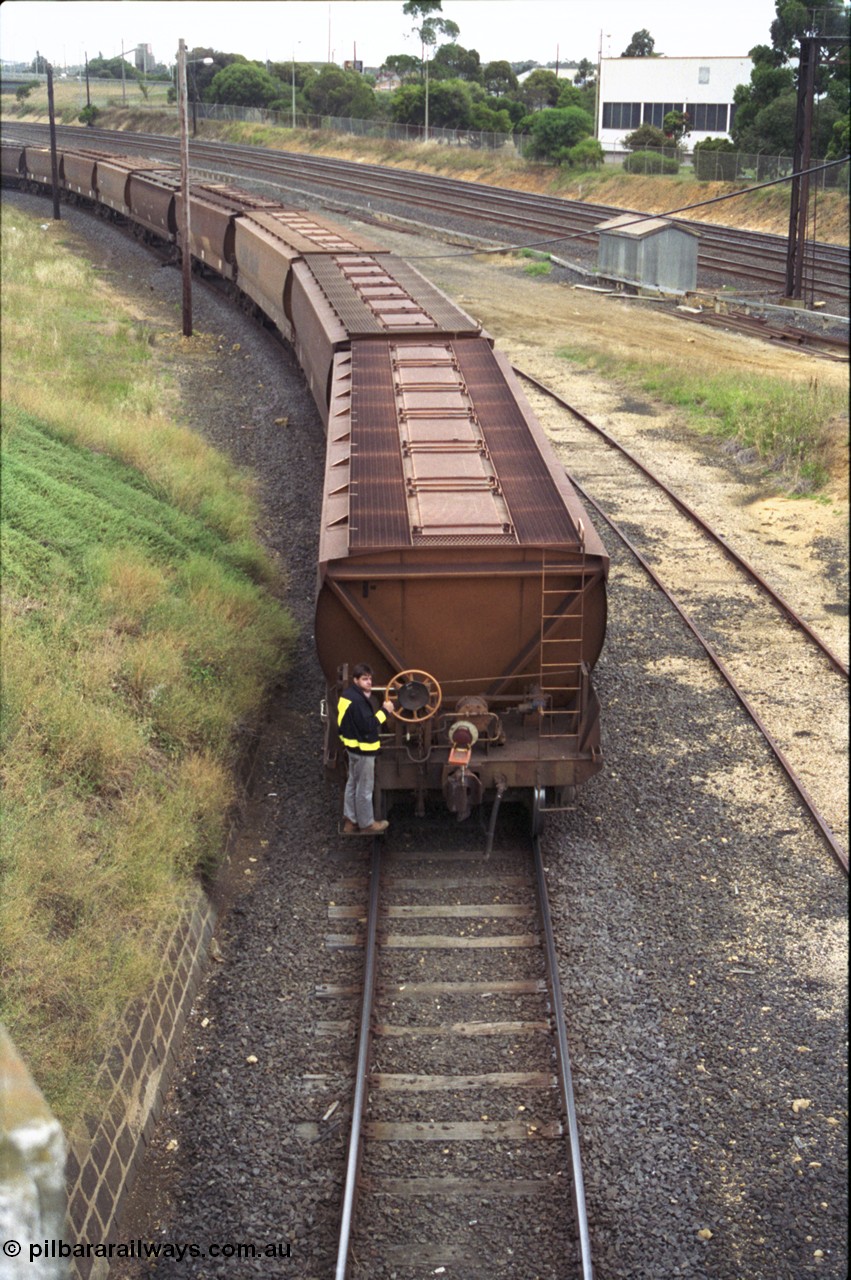 133-11
North Geelong grain loop, shunter on rear grain waggon, Melbourne - Geelong lines at right of image.
