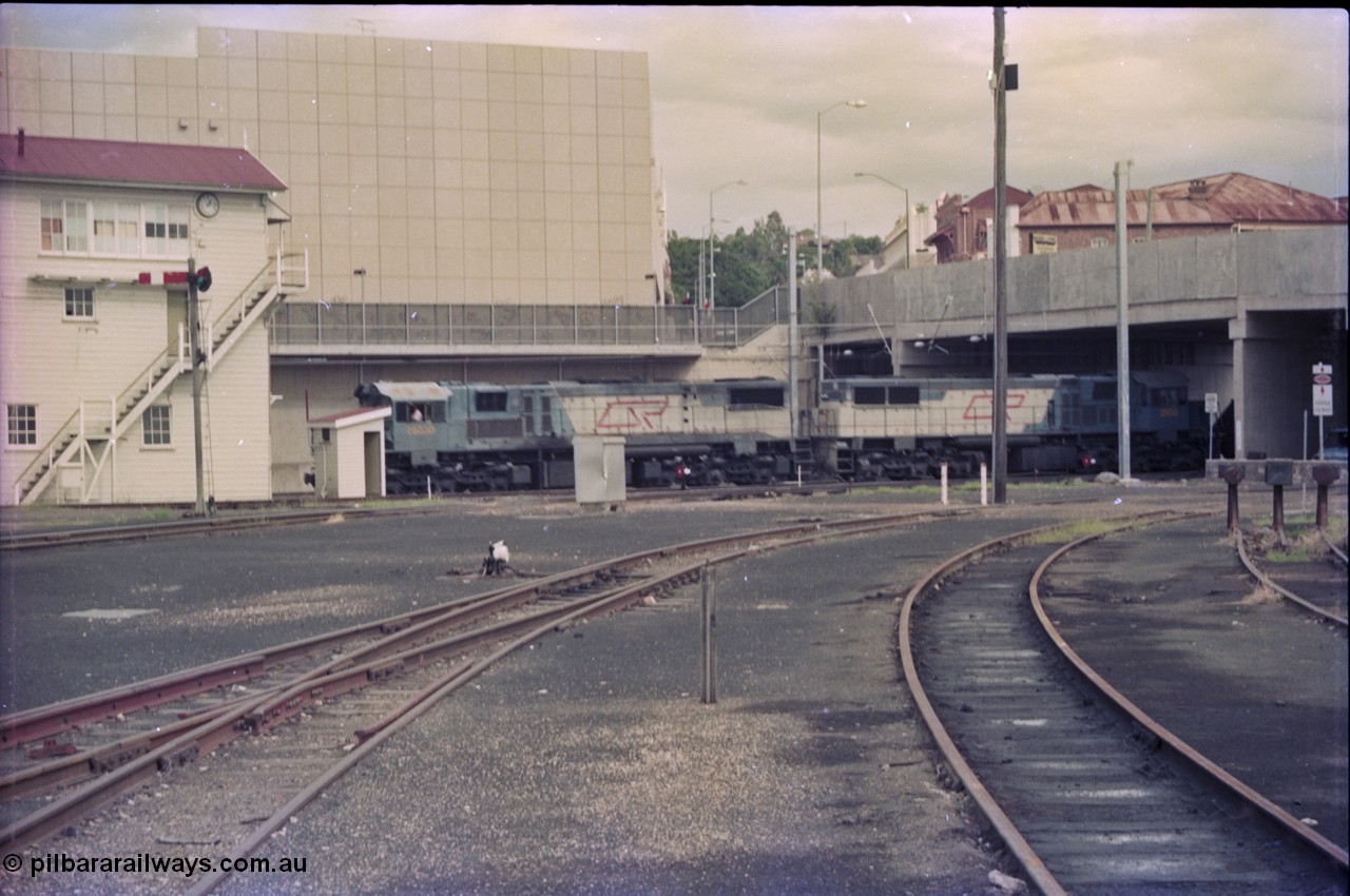 135-02
Loaded coal train sneaks past Ipswich signal box behind QR 2400 class units 2503 and 2500.
