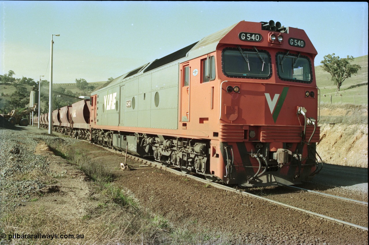135-21
Kilmore East Apex Quarry siding, V/Line broad gauge G class G 540 Clyde Engineering EMD model JT26C-2SS serial 89-1273 on the front of the stone train as it is loaded by the front-end wheel loader.
Keywords: G-class;G540;Clyde-Engineering-Somerton-Victoria;EMD;JT26C-2SS;89-1273;