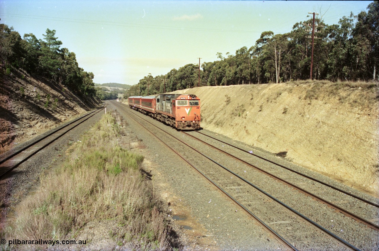 135-22
Heathcote Junction looking south, V/Line's last member of the broad gauge N class N 475 'City of Moe' Clyde Engineering EMD model JT22HC-2 serial 87-1204 with N set, down pass, standard gauge line on the far left.
Keywords: N-class;N475;Clyde-Engineering-Somerton-Victoria;EMD;JT22HC-2;87-1204;