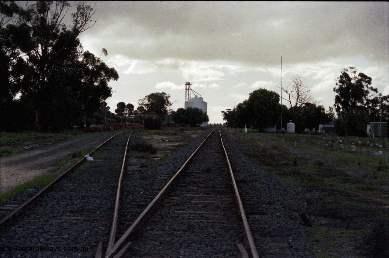 136-01
Mathoura station yard overview looking north, sleeper loading site on the left, Ascom style silo complex, station building and radio repeater tank on the right.
