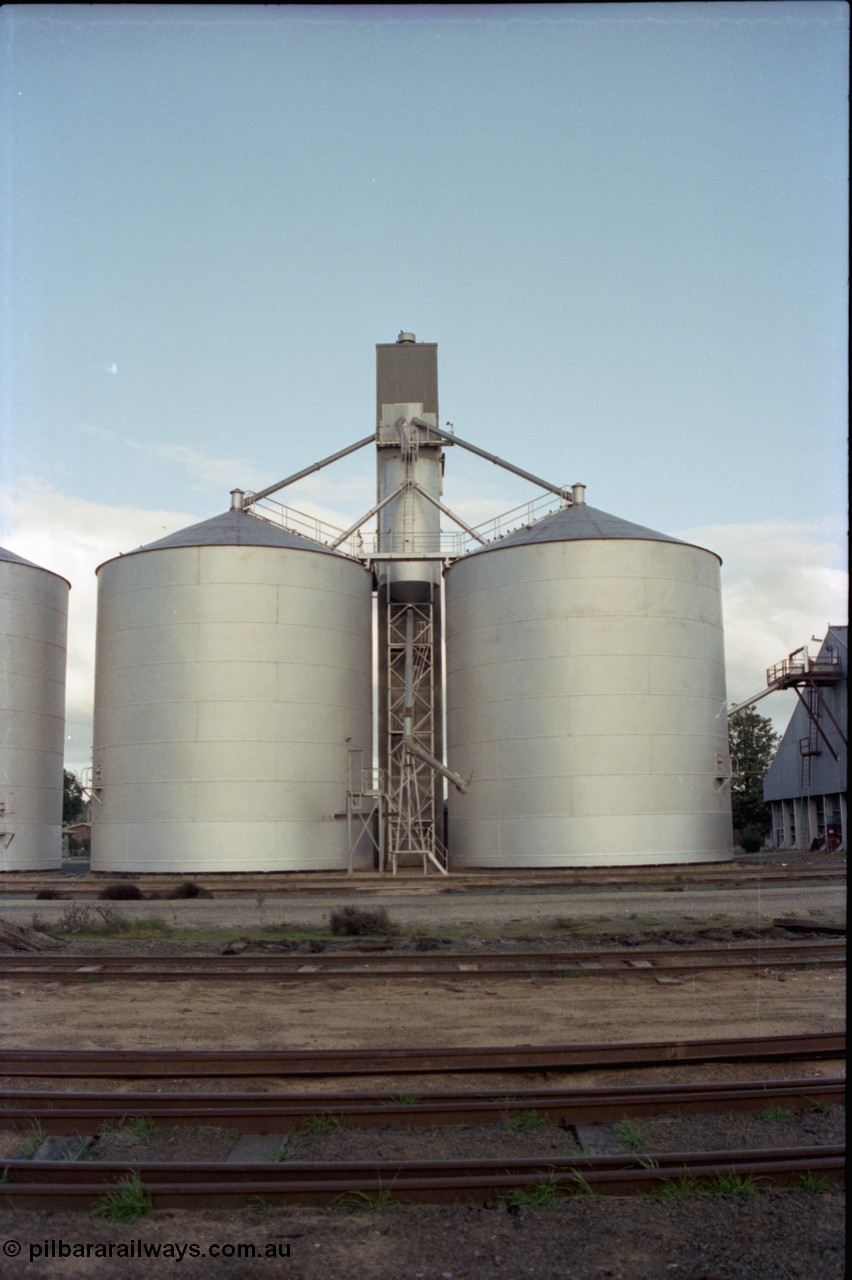 136-19
Deniliquin Ascom style silo complex, track view, loading spout and surge silo.
