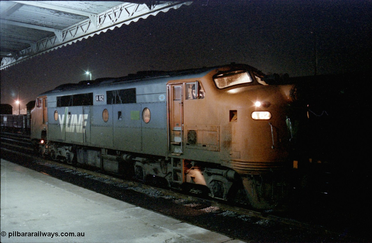 136-28
Seymour station platform view V/Line broad gauge A class A 62 Clyde Engineering EMD model AAT22C-2R serial 84-1183 rebuilt from B 62 Clyde Engineering EMD model ML2 serial ML2-3 waits in the rain to run the Sunday evening down Cobram pass 8354.
Keywords: A-class;A62;Clyde-Engineering-Rosewater-SA;EMD;AAT22C-2R;84-1183;rebuild;bulldog;