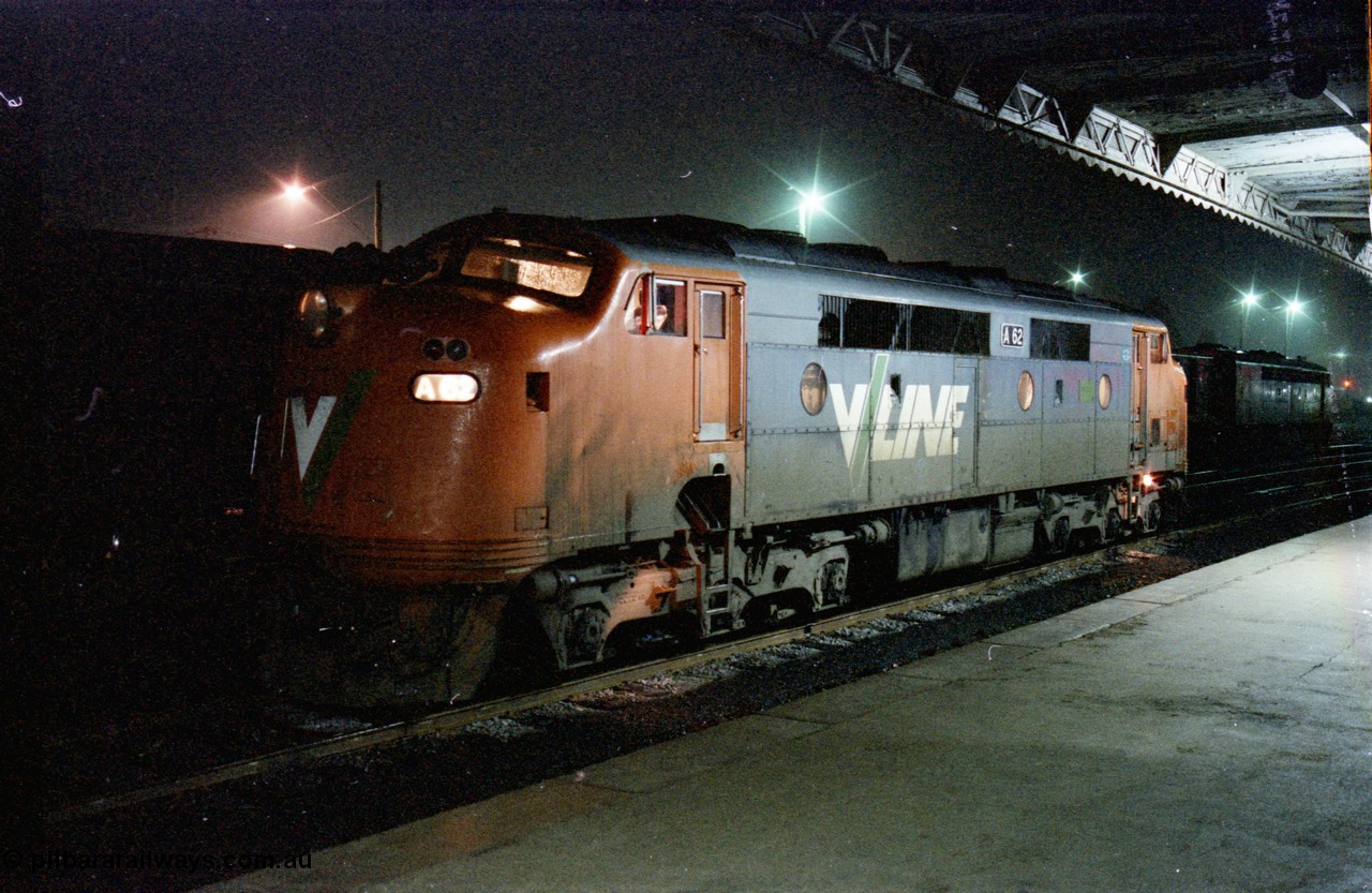 136-30
Seymour station platform view V/Line broad gauge A class A 62 Clyde Engineering EMD model AAT22C-2R serial 84-1183 rebuilt from B 62 Clyde Engineering EMD model ML2 serial ML2-3 waits in the rain to run the Sunday evening down Cobram pass 8345.
Keywords: A-class;A62;Clyde-Engineering-Rosewater-SA;EMD;AAT22C-2R;84-1183;rebuild;bulldog;