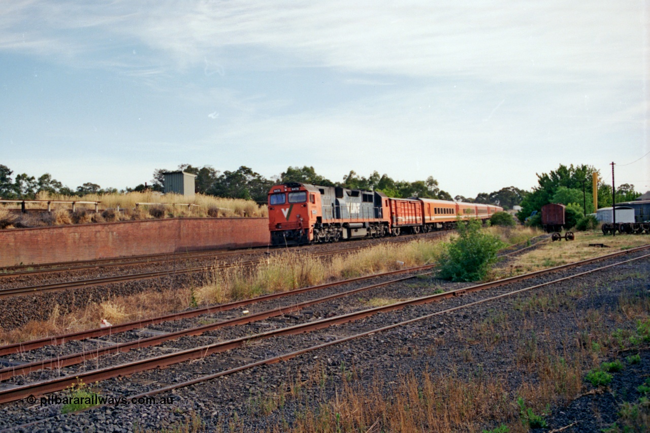 137-1-07
Seymour loco depot, broad gauge V/Line N class N 472 'City of Sale' Clyde Engineering EMD model JT22HC-2 serial 87-1201 leads the morning up Albury pass past the depot at speed, from the brick wall is the line to Cobram and Tocumwal broad gauge, the Wodonga - Albury broad gauge and the Albury standard gauge line, then the standard gauge loco sidings, the depot and turntable are to the right.
Keywords: N-class;N472;Clyde-Engineering-Somerton-Victoria;EMD;JT22HC-2;87-1201;
