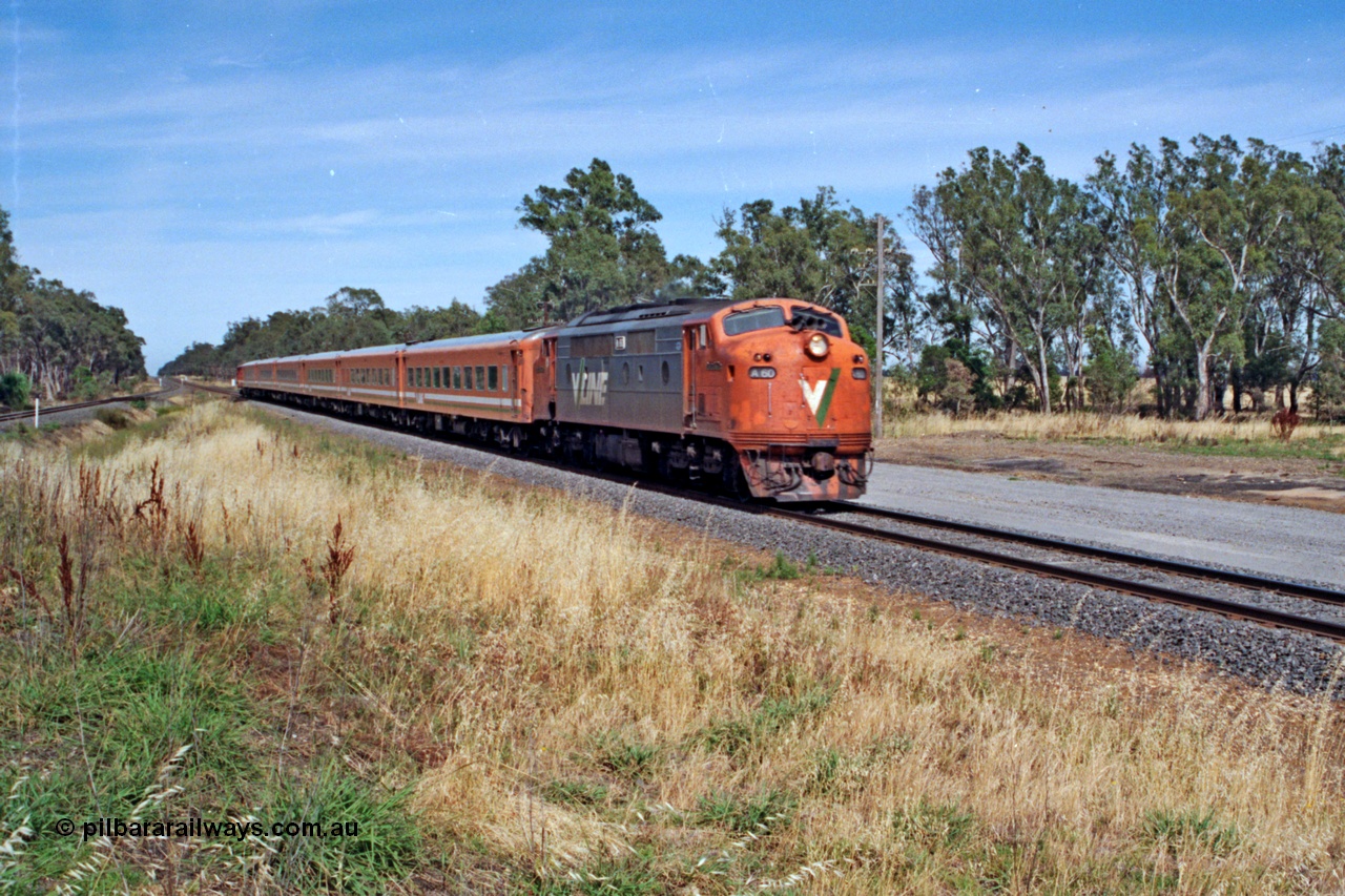 137-1-09
Euroa, down broad gauge Albury passenger train with V/Line A class A 60 'Sir Harold Clapp' Clyde Engineering EMD model AAT22C-2R serial 84-1184 rebuilt from B 60 'Sir Harold Clapp' Clyde Engineering EMD model ML2 serial ML2-1 and double N set, standard gauge line is at extreme left.
Keywords: A-class;A60;Clyde-Engineering-Rosewater-SA;EMD;AAT22C-2R;84-1184;rebuild;bulldog;