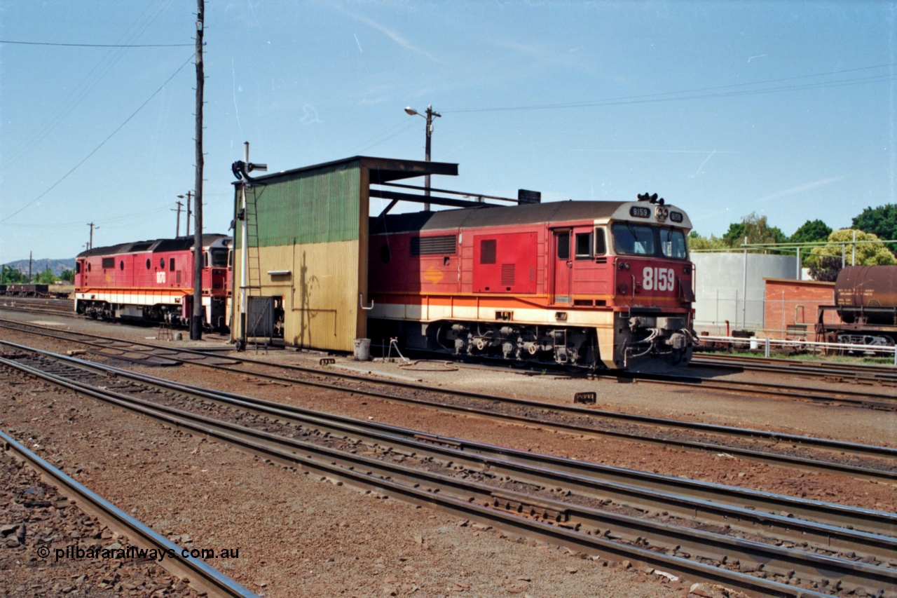 137-1-23
Albury loco depot fuel point, standard gauge NSWSRA 81 class locos 8159 Clyde Engineering EMD model JT26C-2SS serial 84-1078 and 8170 serial 85-1089 receive attention.
Keywords: 81-class;8159;Clyde-Engineering-Kelso-NSW;EMD;JT26C-2SS;84-1078;