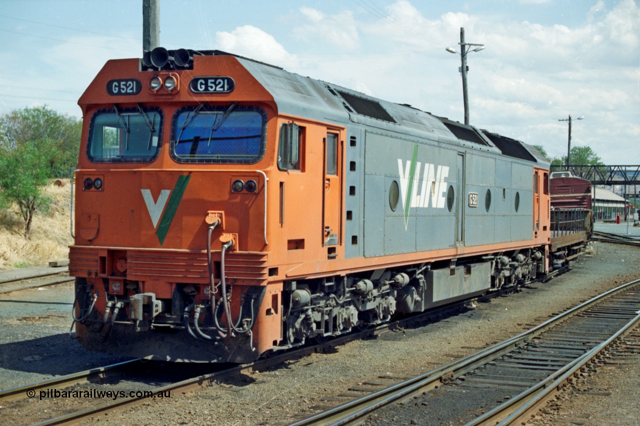 137-1-25
Albury loco depot, V/Line standard gauge loco G class G 521 Clyde Engineering EMD model JT26C-2SS serial 85-1234 rests between jobs, the road to the turntable is to the left of the loco, behind it is a NSW shunters float and guards van.
Keywords: G-class;G521;Clyde-Engineering-Rosewater-SA;EMD;JT26C-2SS;85-1234;