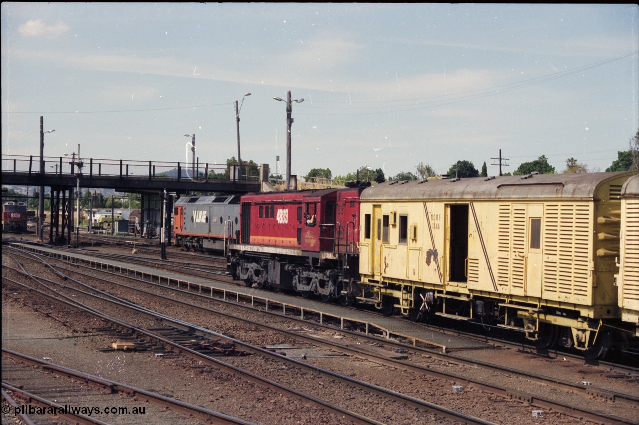 137-2-02
Albury station yard view, NSWSRA 48 class loco 4889 AE Goodwin ALCo model DL531 serial G3420-4 shunts near the station building with an NDMF class bogie guards van NDMF 1446, V/Line G class G 521 is in the background.
Keywords: 48-class;4889;AE-Goodwin;ALCo;RSD-8;DL531;G3420-4;