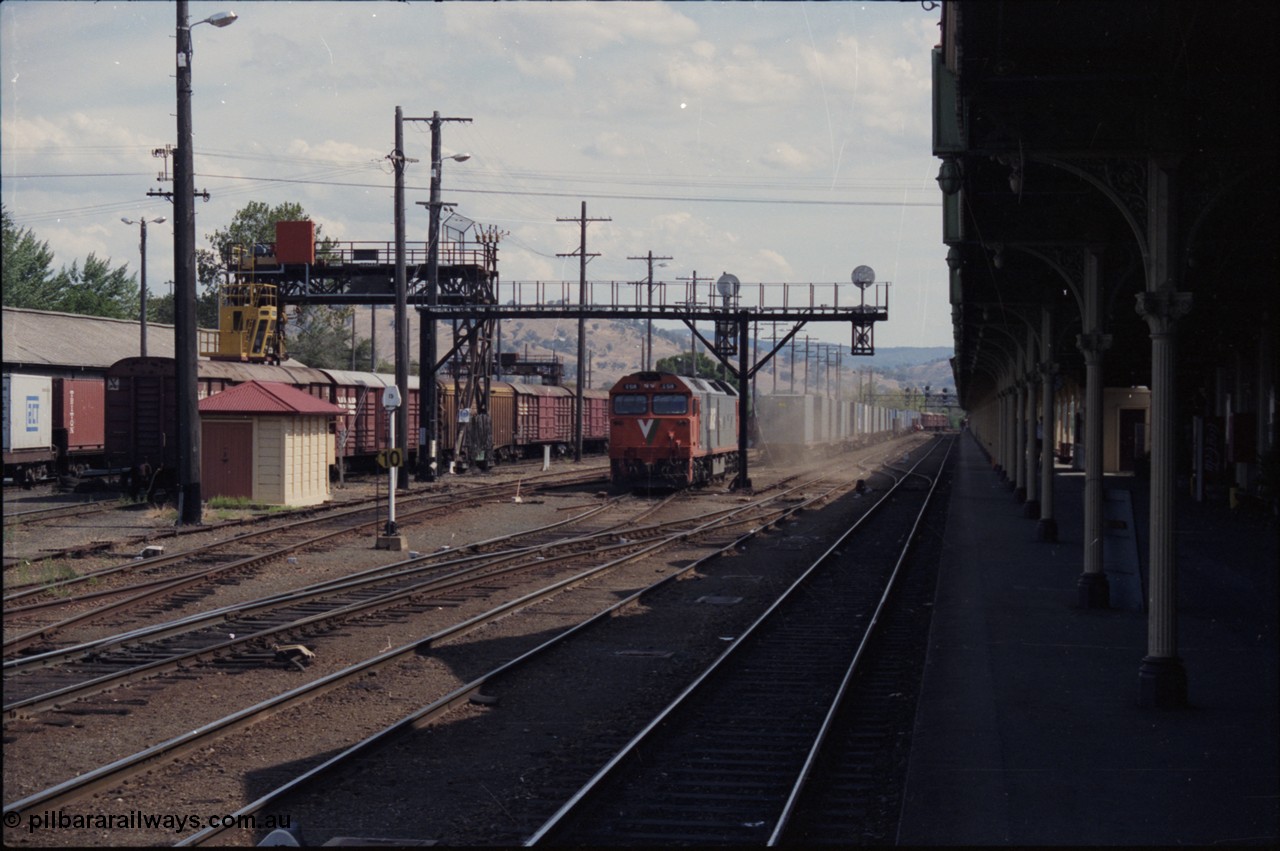 137-2-06
Albury station yard overview, standard gauge V/Line G class G 518 Clyde Engineering EMD model JT26C-2SS serial 85-1231 raises the dust as it cuts off the down goods train, the unit will head to loco, to the left of G 518 is the broad gauge goods loop.
Keywords: G-class;G518;Clyde-Engineering-Rosewater-SA;EMD;JT26C-2SS;85-1231;