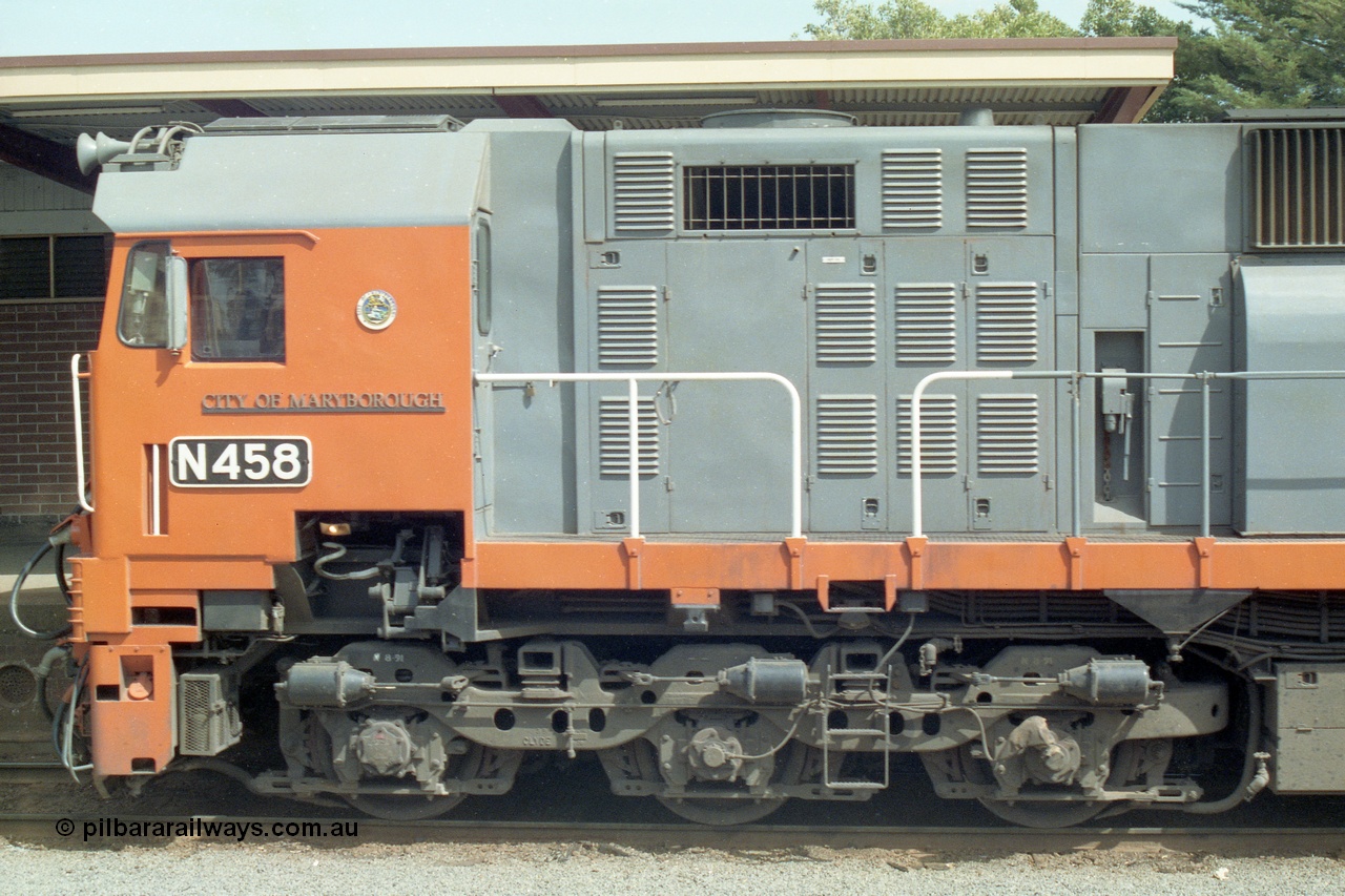 138-15
Bendigo station, cab side view, number board and name plate of V/Line broad gauge N class Loco N 458 'City of Maryborough' Clyde Engineering EMD model JT22HC-2 serial 85-1226.
Keywords: N-class;N458;Clyde-Engineering-Somerton-Victoria;EMD;JT22HC-2;85-1226;