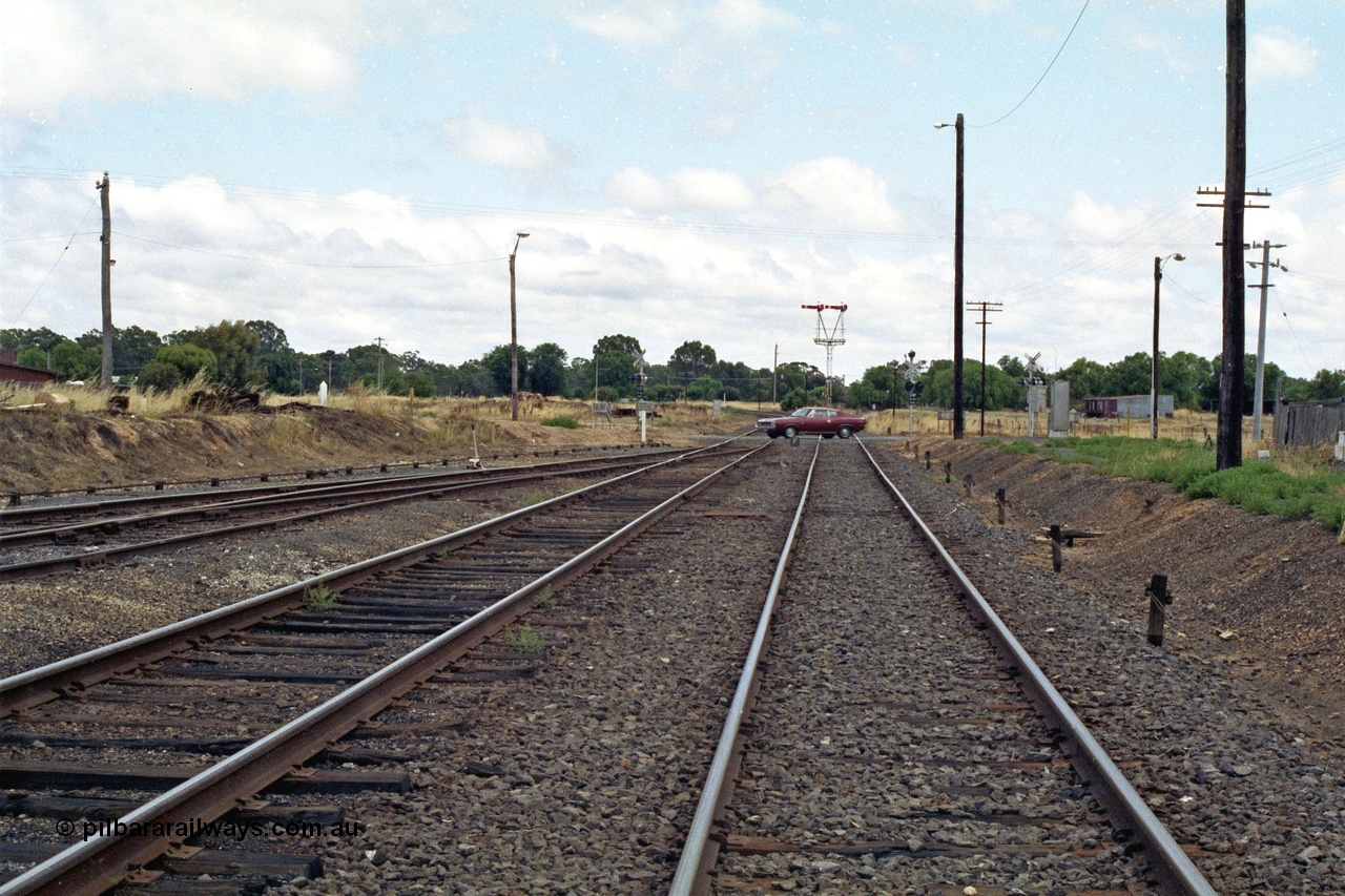 138-20
Dunolly, yard view looking north from station, Mildura line curves to the left, and the Inglewood line to the right, on the other side of the Valiant Charger!, Semaphore signal post 2 is the down departure for both lines.
