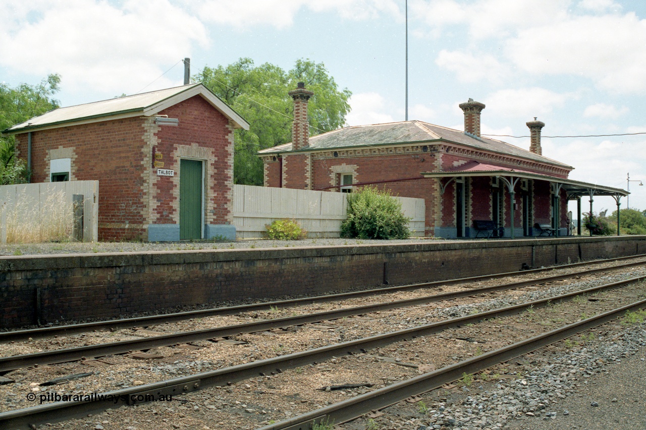 138-24
Talbot station overview, built around 1875, platform, brick lamp room and station building, track view, looking north.
