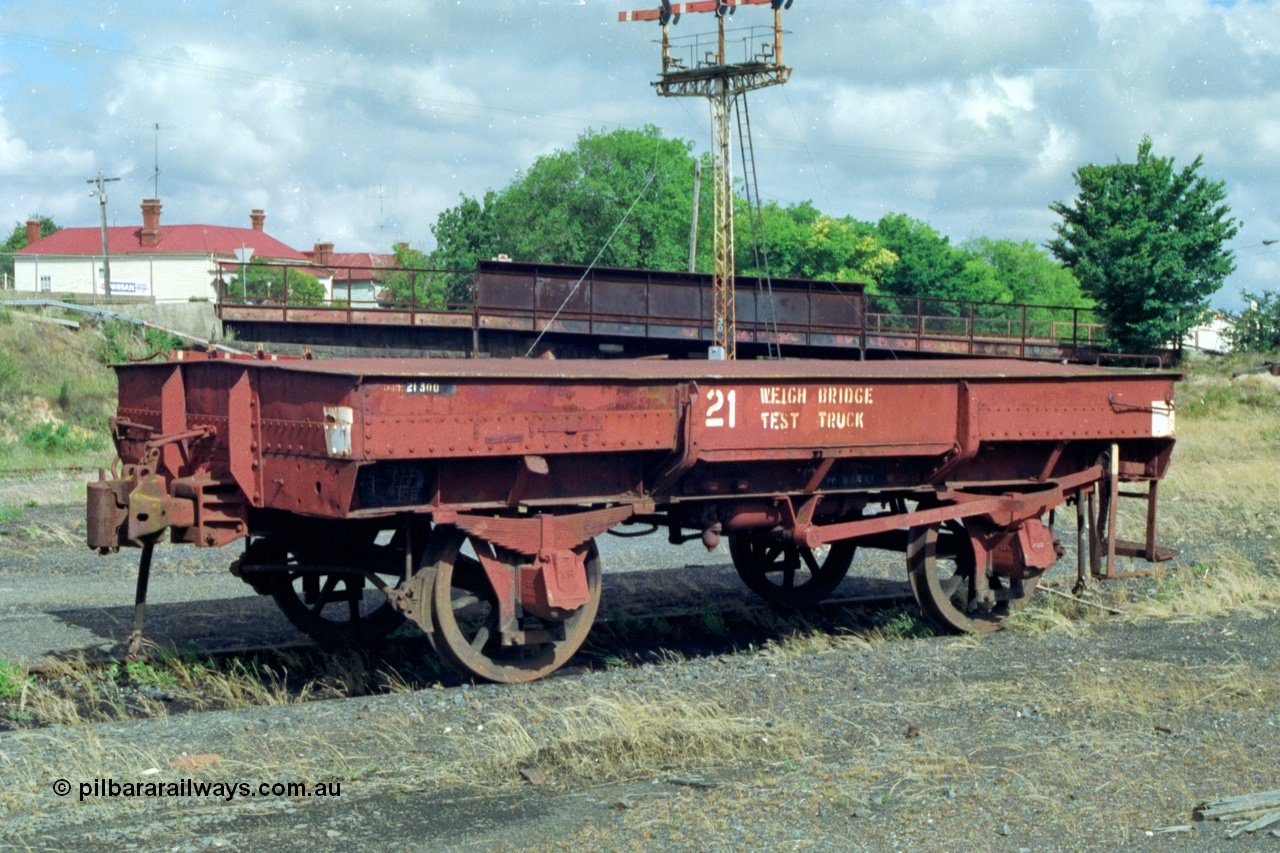 139-18
Ballarat, Doveton Street Sidings, weigh bridge test truck, WTT type four wheel weighbridge test waggon WTT 21, converted from IA type four wheel open waggon IA 7448. Started life as I type I 7448 built by Newport Workshops in January 1905, to IA type in 1935, converted to WTT type in April 1956.
Keywords: WTT-type;WTT21;IA-type;IA7448;Victorian-Railways-Newport-WS;I-type;I7448;