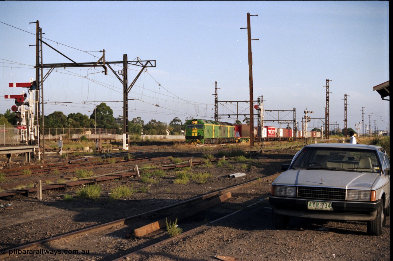 141-1-08
Sunshine, broad gauge Australian National BL class units BL 28 Clyde Engineering EMD model JT26C-2SS serial 83-1012 and BL 27 serial 83-1011 lead the second of the afternoon procession of down Adelaide bound goods trains out of Melbourne along the passenger lines.
Keywords: BL-class;BL28;Clyde-Engineering-Rosewater-SA;EMD;JT26C-2SS;83-1012;