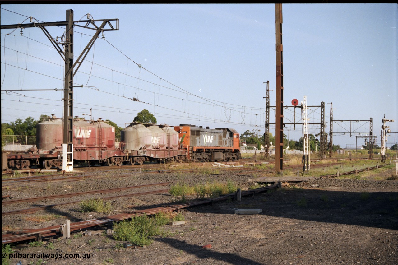 141-2-19
Sunshine, broad gauge V/Line X class X 45 'Edgar H Brownbill' Clyde Engineering EMD model G26C serial 75-792 leads an up Bendigo goods train through Sunshine bound for Tottenham Yard, in this trailing view two VPCX class bogie cement waggons are leading consist.
Keywords: X-class;X45;Clyde-Engineering-Rosewater-SA;EMD;G26C;75-792;