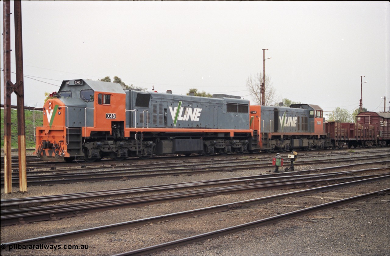 142-1-24
Benalla yard view, stabled broad gauge Wodonga goods train 9303 with V/Line X class X 48 Clyde Engineering EMD model G26C serial 75-795 and T class T 408 Clyde Engineering EMD model G18B serial 68-624, dwarf disc signal 13 and point indicator, track view, point rodding.
Keywords: X-class;X48;Clyde-Engineering-Rosewater-SA;EMD;G26C;75-795;