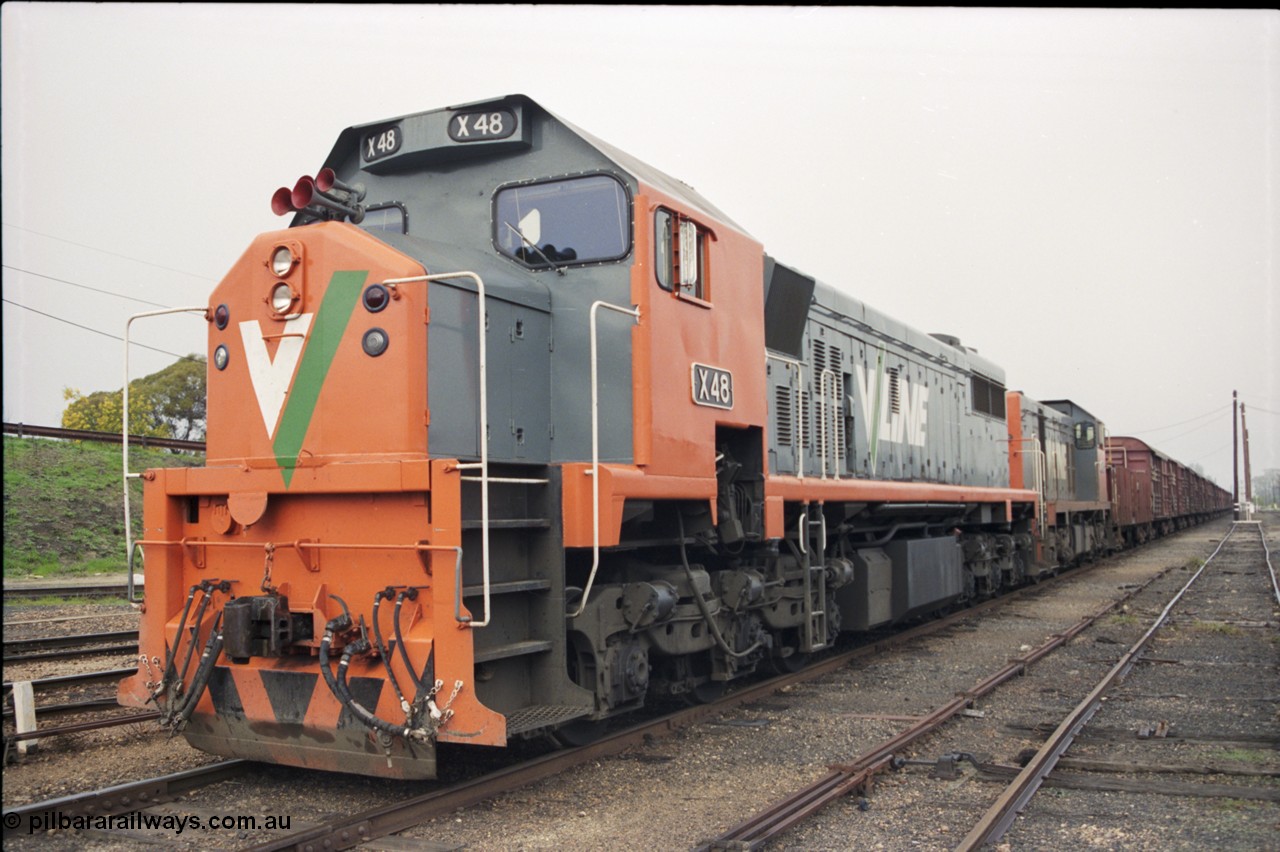 142-1-26
Benalla yard view, stabled broad gauge Wodonga goods train 9303 with V/Line X class X 48 Clyde Engineering EMD model G26C serial 75-795 and T class T 408 Clyde Engineering EMD model G18B serial 68-624.
Keywords: X-class;X48;Clyde-Engineering-Rosewater-SA;EMD;G26C;75-795;