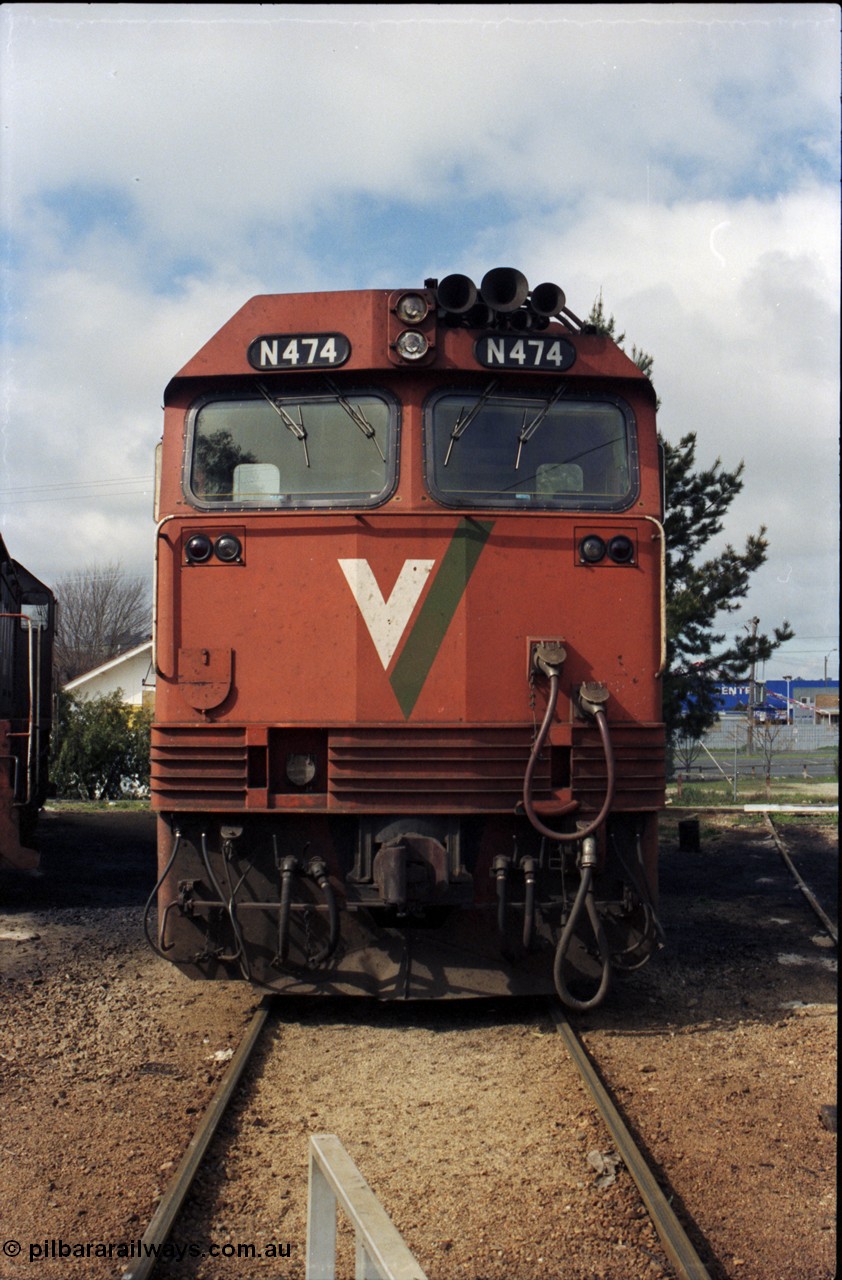 142-2-14
Wodonga loco depot, turntable roads, V/Line broad gauge N class loco N 474 'City of Traralgon' Clyde Engineering EMD model JT22HC-2 serial 87-1203 rests between jobs at the turntable, cab front view.
Keywords: N-class;N474;Clyde-Engineering-Somerton-Victoria;EMD;JT22HC-2;87-1203;