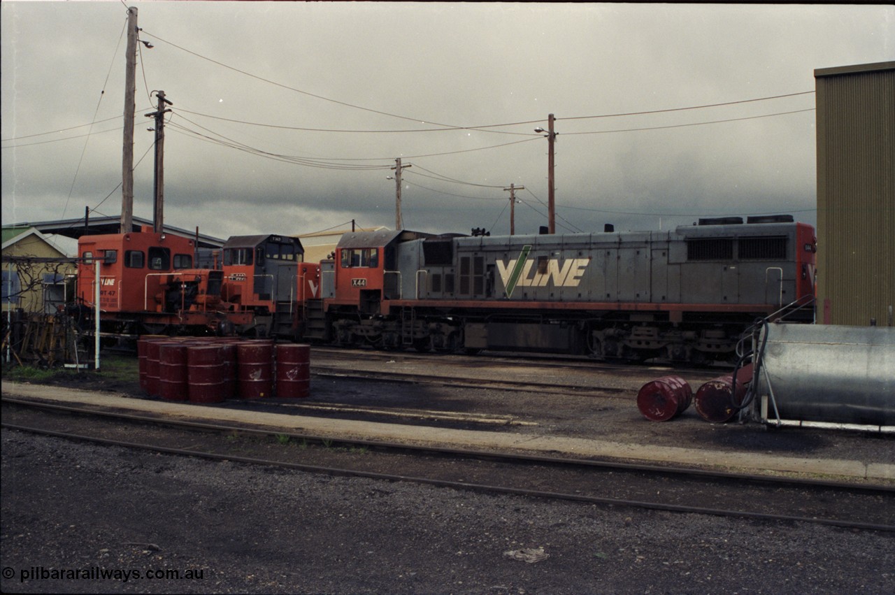 142-2-18
Wodonga loco depot, view across service roads, broad gauge V/Line units RT class rail tractor RT 47, T class T 369 Clyde Engineering EMD model G8B serial 64-324 and X class X 44 Clyde Engineering EMD model G26C serial 70-707.
Keywords: X-class;X44;Clyde-Engineering-Granville-NSW;EMD;G26C;70-707;