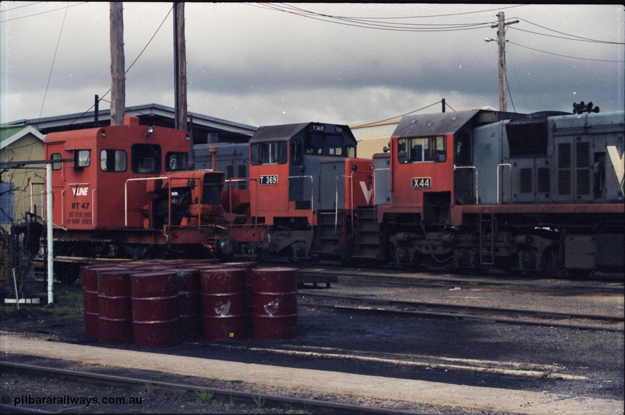 142-2-19
Wodonga loco depot, close up view across service roads, broad gauge V/Line units RT class rail tractor RT 47, T class T 369 Clyde Engineering EMD model G8B serial 64-324 and X class X 44 Clyde Engineering EMD model G26C serial 70-707.
Keywords: X-class;X44;Clyde-Engineering-Granville-NSW;EMD;G26C;70-707;