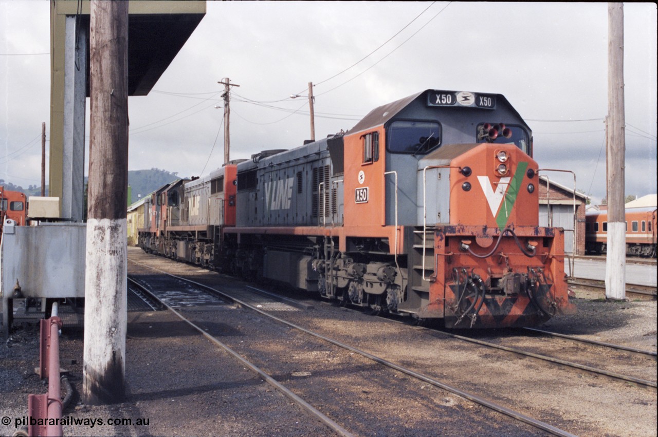 142-2-24
Wodonga loco depot fuel point, V/Line broad gauge loco combination of X class X 50 Clyde Engineering EMD model G26C serial 75-797, X 44 serial 70-707 and T class T 369 Clyde Engineering EMD model G8B serial 64-324 wait for sign on time to run the Sunday evening 9334 up Albury steel train.
Keywords: X-class;X50;Clyde-Engineering-Rosewater-SA;EMD;G26C;75-797;