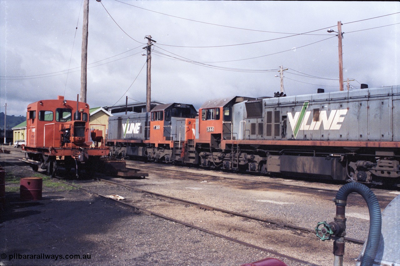 142-2-25
Wodonga loco depot, view across service roads, broad gauge V/Line units RT class rail tractor RT 47, T class T 369 Clyde Engineering EMD model G8B serial 64-324 and X class X 44 Clyde Engineering EMD model G26C serial 70-707.
Keywords: X-class;X44;Clyde-Engineering-Granville-NSW;EMD;G26C;70-707;