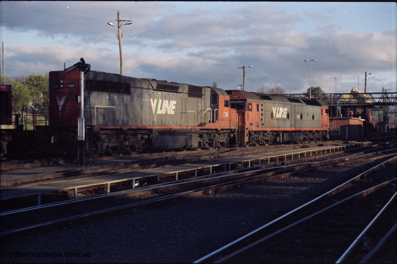 142-3-13
Albury station yard, V/Line standard gauge locos G class G 527 Clyde Engineering EMD model JT26C-2SS serial 88-1257 and C class C 503 Clyde Engineering EMD model GT26C serial 76-826 shunt out of the loco fuelling service roads in the middle of Albury yard, semaphore signal pulled off for move.
Keywords: C-class;C503;Clyde-Engineering-Rosewater-SA;EMD;GT26C;76-826;