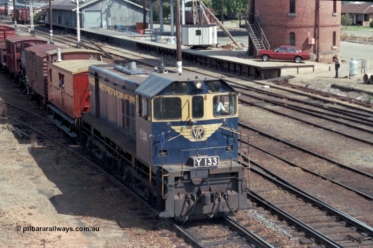 143-07
Wangaratta, broad gauge VR liveried Y class Y 133 Clyde Engineering EMD model G6B serial 65-399 departs with the down special 'Stringybark Express' mixed train to Springhurst and Wahgunyah.
Keywords: Y-class;Y133;Clyde-Engineering-Granville-NSW;EMD;G6B;65-399;