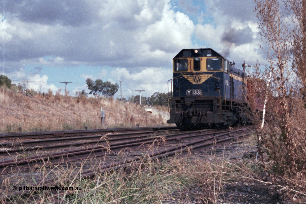 143-15
Springhurst, broad gauge VR liveried Y class Y 133 Clyde Engineering EMD model G6B serial 65-399 blast out of No. 2 Rd onto the Wahgunyah line with the down Wahgunyah mixed 'Stringybark Express' special, standard gauge line is on the embankment in the background, damn weeds...
Keywords: Y-class;Y133;Clyde-Engineering-Granville-NSW;EMD;G6B;65-399;