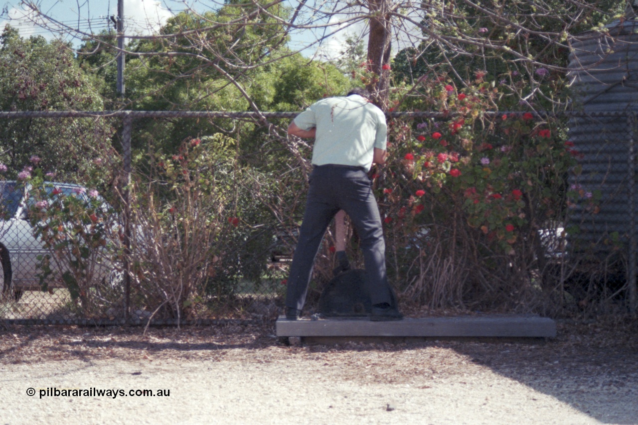 143-18
Rutherglen, station platform, the signaller pulls off the down home signal.
