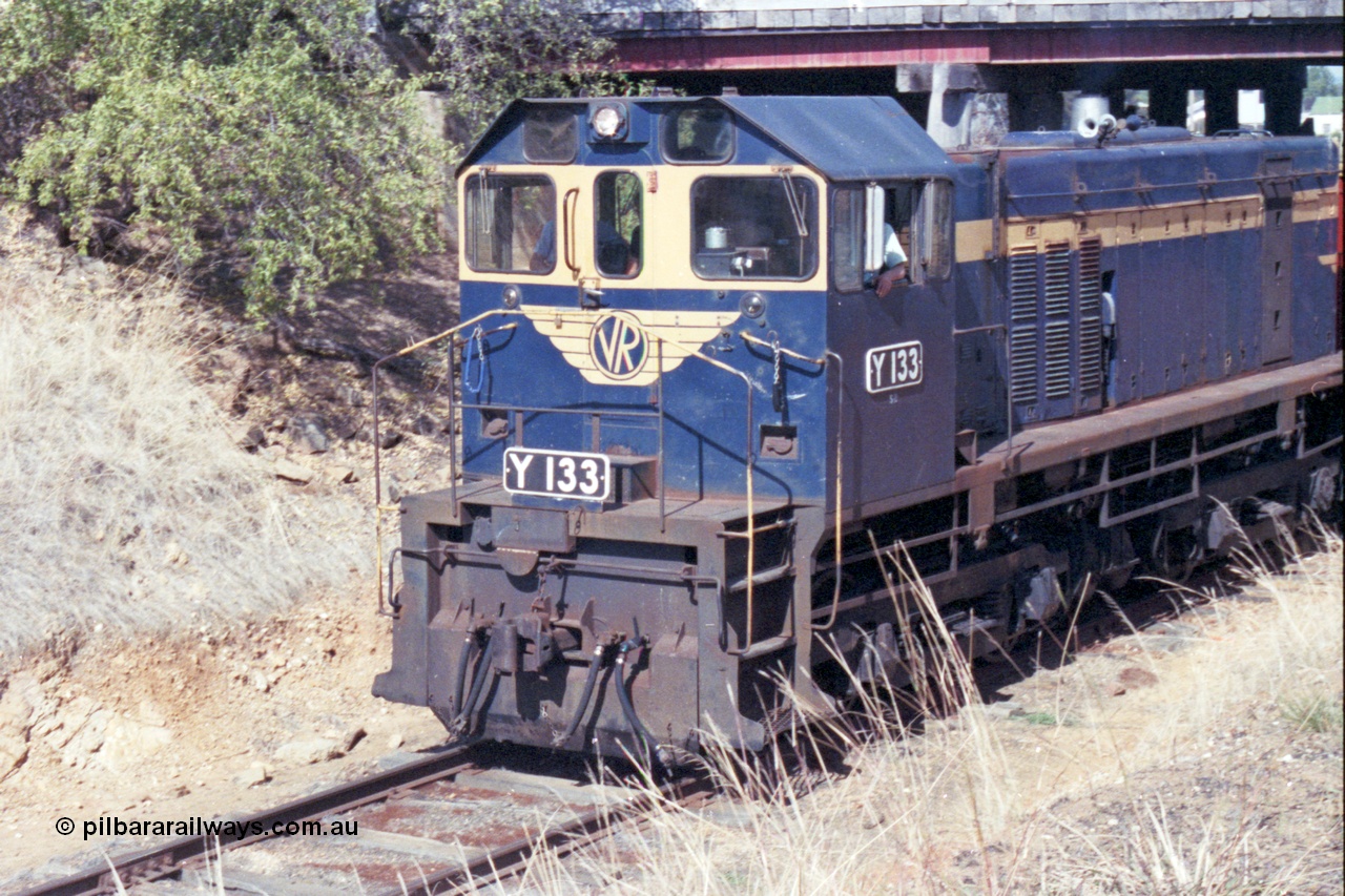 143-22
Rutherglen, High St over bridge, broad gauge VR liveried Y class Y 133 Clyde Engineering EMD model G6B serial 65-399 departs.
Keywords: Y-class;Y133;Clyde-Engineering-Granville-NSW;EMD;G6B;65-399;