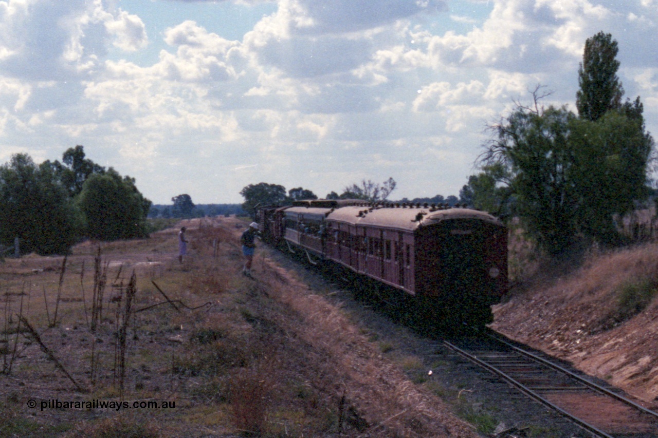 143-23
Rutherglen, down 'Stringybark Express' special climbs up grade towards Wahgunyah having just past under the High St over bridge.
