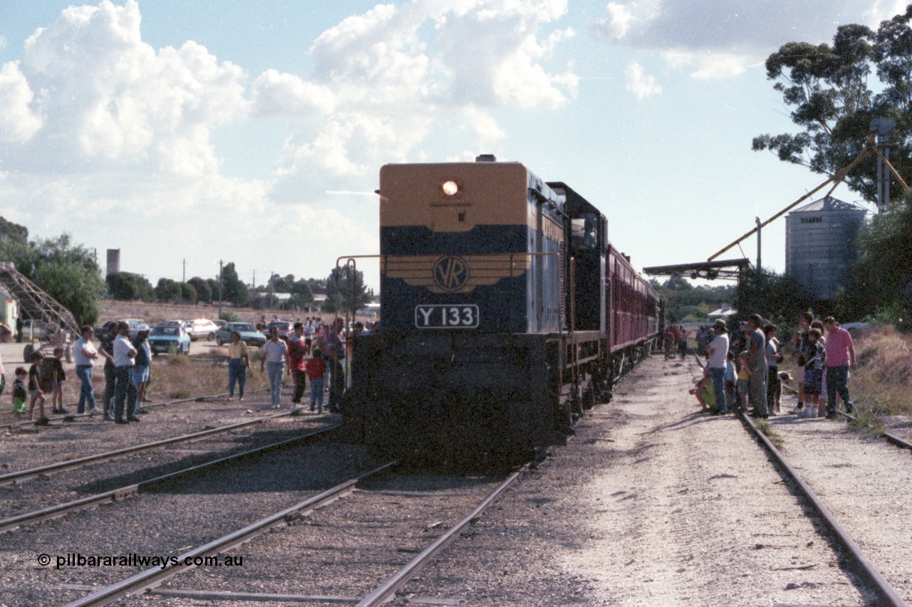143-29
Wahgunyah, broad gauge VR liveried Y class Y 133 Clyde Engineering EMD model G6B serial 65-399 sits on the point of the up 'Stringybark Express' mixed special as it awaits departure time. The silo structure on the right stands on the former station building platform.
Keywords: Y-class;Y133;Clyde-Engineering-Granville-NSW;EMD;G6B;65-399;