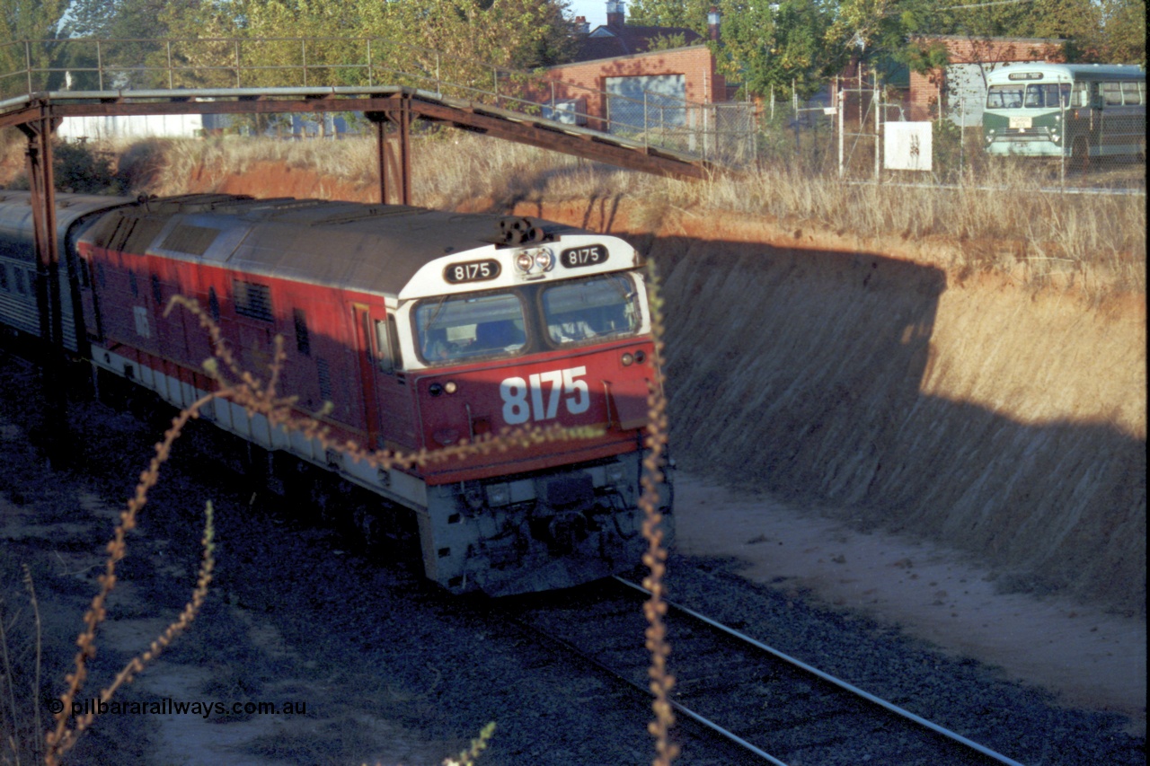 144-13
Wangaratta, standard gauge NSWSRA 81 class 8175 Clyde Engineering EMD model JT26C-2SS serial 85-1094, candy livery, leads the up Inter-Capital Daylight through the cutting and under the footbridge on the way to Melbourne.
Keywords: 81-class;8175;Clyde-Engineering-Kelso-NSW;EMD;JT26C-2SS;85-1094;