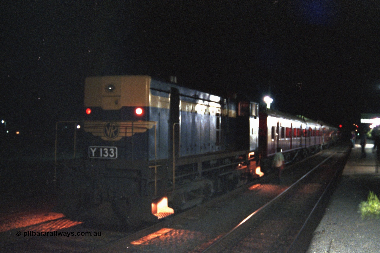 144-21
Euroa station platform view, broad gauge VR liveried Y class Y 133 Clyde Engineering EMD model G6B serial 65-399 with the up Wahgunyah 'Stringybark Express' mixed sits in No. 2 Rd awaiting a cross, night time exposure.
Keywords: Y-class;Y133;Clyde-Engineering-Granville-NSW;EMD;G6B;65-399;