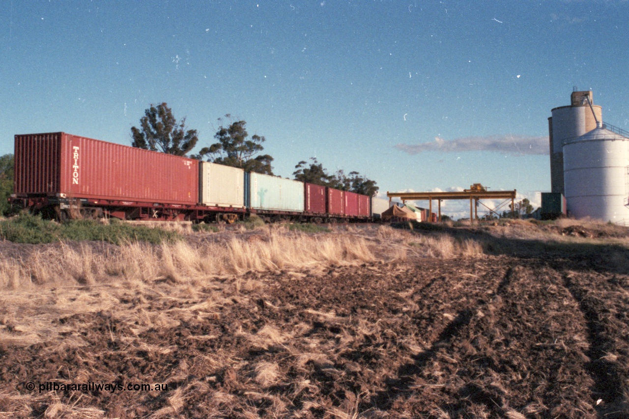 144-36
Boort yard overview, silo complex, containers on waggons, broad gauge V/Line RT class rail tractor RT 42?? in the background, gantry crane. Boort used to have two rail tractors assigned back in these days.
