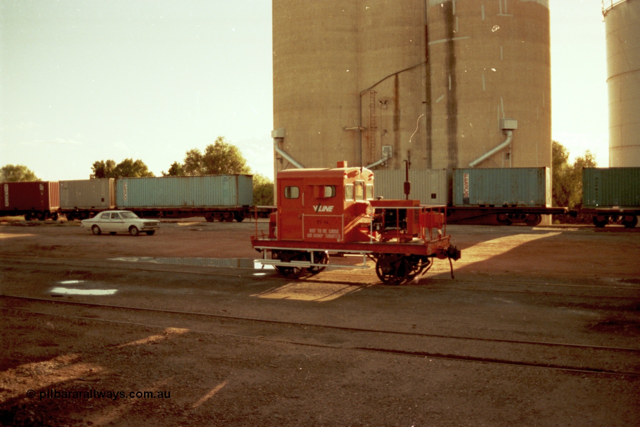 144-37
Boort yard view, silos with loading spouts, containers on waggons, Holden HK sedan and broad gauge V/Line RT class rail tractor RT 14. RT 14 was built new by Newport Workshops June 1959.
Keywords: RT-class;RT14;Victorian-Railways-Newport-WS;