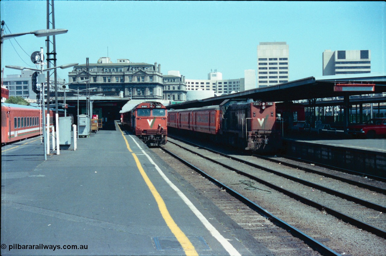 145-10
Spencer Street Station platform view of Platforms 4 and 5, broad gauge V/Line locos N class N 469 'City of Morwell' Clyde Engineering EMD model JT22HC-2 serial 86-1198 with N set and P class P 22 Clyde Engineering EMD model G18HBR serial 84-1215 rebuilt from T 328 Clyde Engineering EMD model G8B serial 56-80 with H set ready to run afternoon down passenger trains, note the private car on the platform.
Keywords: N-class;N469;Clyde-Engineering-Somerton-Victoria;EMD;JT22HC-2;86-1198;