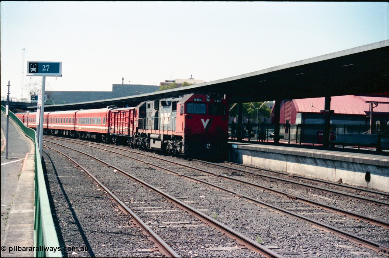 145-11
Spencer Street Station dual gauge Platform Number 1, broad gauge V/Line N class N 452 'Rural City of Wodonga' Clyde Engineering EMD model JT22HC-2 serial 85-1220 arrives with a 5 car N set.
Keywords: N-class;N452;Clyde-Engineering-Somerton-Victoria;EMD;JT22HC-2;85-1220;