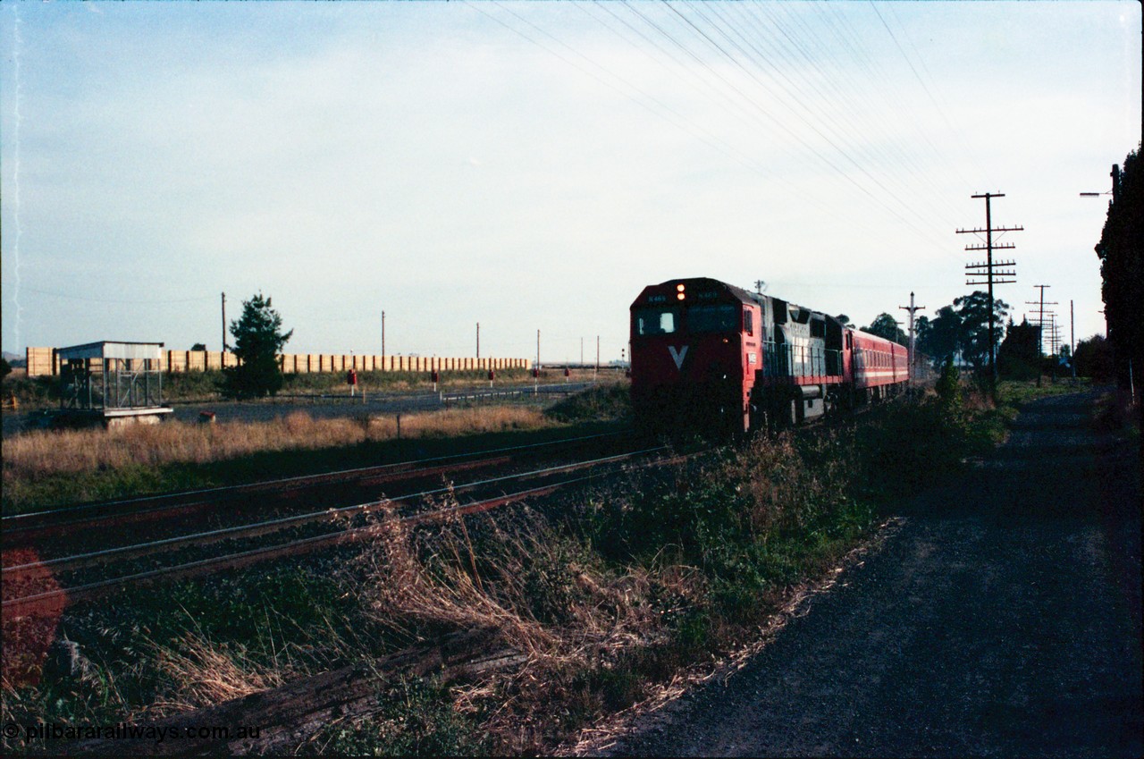 145-25
Wallan, down broad gauge passenger train hauled by V/Line N class N 469 'City of Morwell' Clyde Engineering EMD model JT22HC-2 serial 86-1198 and N set past the remains of disc signal post 15, at left is the 'Gang Camp' area with sound proofing wall.
Keywords: N-class;N469;Clyde-Engineering-Somerton-Victoria;EMD;JT22HC-2;86-1198;