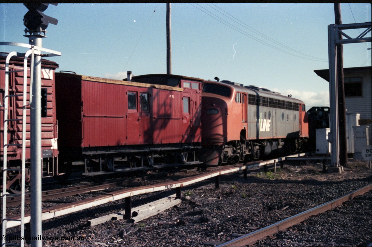 147-11
Seymour 'B' signal box and signal post 30 with SRHC shunt in progress, ZL type six wheel guards van ZL 2, V/Line liveried B class B 74 Clyde Engineering EMD model ML2 serial ML2-15.
Keywords: B-class;B74;Clyde-Engineering-Granville-NSW;EMD;ML2;ML2-15;bulldog;