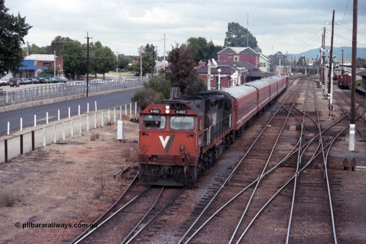 148-08
Wangaratta yard view with V/Line broad gauge N class N 460 'City of Castlemaine' Clyde Engineering EMD model JT22HC-2 serial 85-1228 with N set on down Albury passenger departing the station.
Keywords: N-class;N460;Clyde-Engineering-Somerton-Victoria;EMD;JT22HC-2;85-1228;