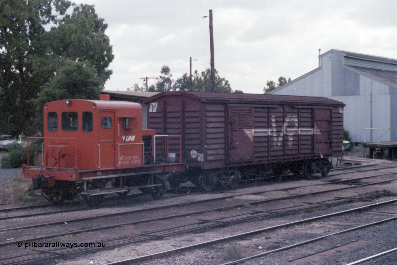 148-10
Wangaratta, V/Line rail tractor RT 5 and VLBY type louvre van VLBY 148 on No.5 Rd, goods shed behind and point rodding in foreground, cover for automatic electric staff exchanger visible. RT 5 built new by Newport Workshops September 1957. The VLBY which is the Wangaratta parcels waggon started out being built by Newport Workshops October 1956 as a VP type VP 148, in May 1979 re-coded to VLPY, re-coded again in 1982 to VLBY.
Keywords: RT-class;RT5;Victorian-Railways-Newport-WS;VLBY-type;VLBY148;VP-type;VLPY-type;