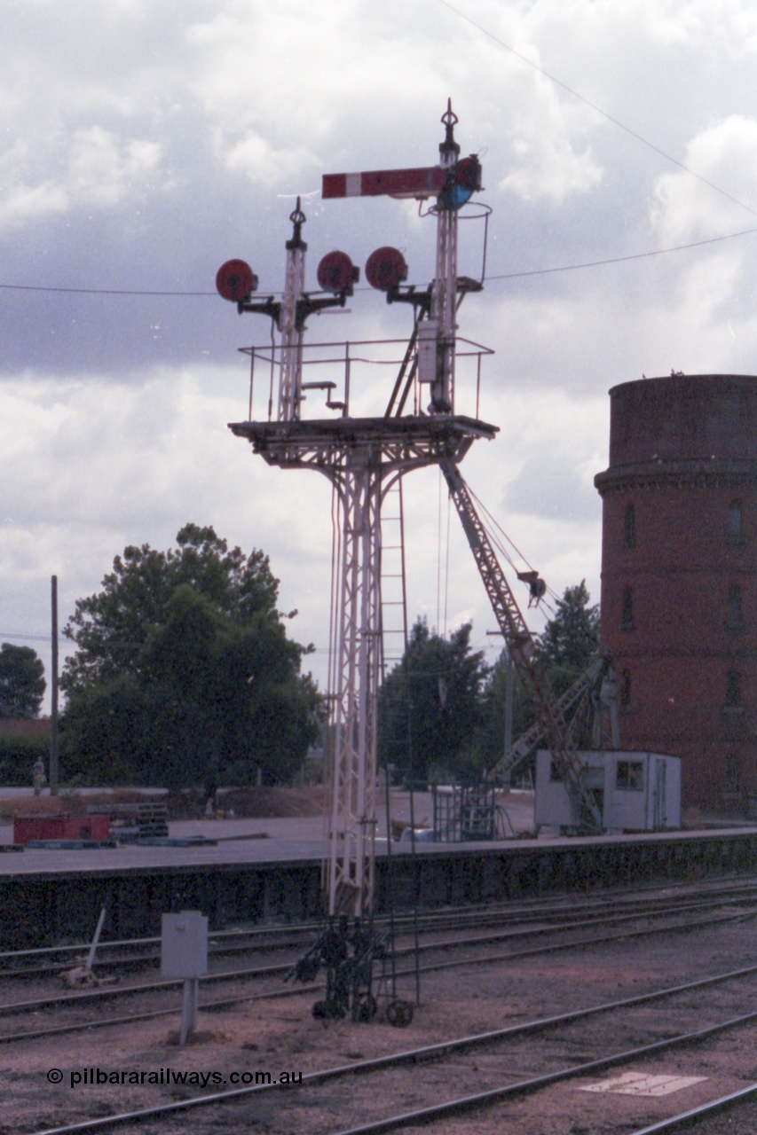 148-15
Wangaratta, Signal Post 17, one arm and three discs, the arm is Down Home Signal No.2 to Main Line, top Left-hand Disc from No. 3 Road to Siding 'C', top Right-hand disc from No. 3 Road to Main Line, Bottom Disc from No. 2 Road to Siding 'C'.
