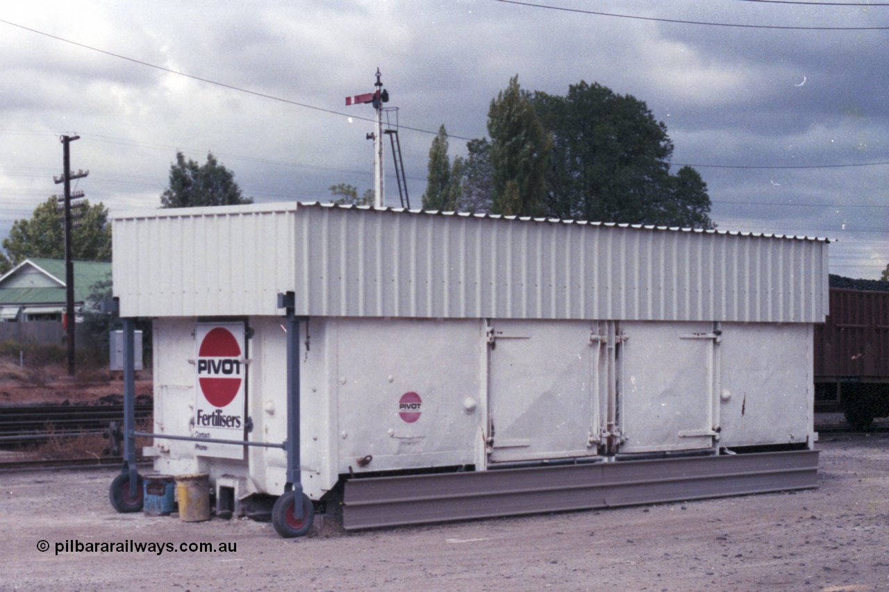 148-28
Wangaratta, ex VR waggon G type G 16113 grounded for use as super phosphate storage by the local agent McDonald's. This G class started out as HY type HY 16113 built new July 1949, recoded to GY in 1962, then G in 1982. Off register 1986. With Signal Post 12 visible over the top of waggon.
Keywords: G-type;GY-type;Victorian-Railways-Newport-WS;HY-type;G16113;